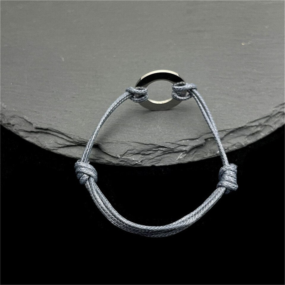 Rope Bracelet with Engraved Round Amulet